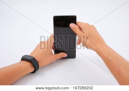 Fitness Bracelet And Phone In Female Hands On White