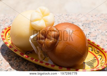 Traditional Italian Hard Cheese Provolone Of Caciocavallo, White And Smoked.