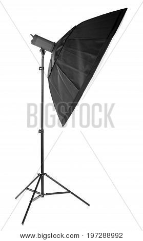 A modern electric saturated black octobox on a tripod. A huge octobox isolated over the white background. Equipment for photogrphers. Professional shooting in a photostudio.