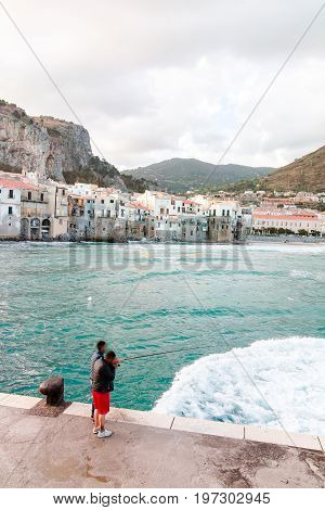 Touristic And Vacation Pearl Of Sicily, Fishermen In Small Town Of Cefalu, Sicily, South Italy, Sea