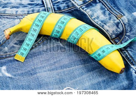 Banana Wrapped With Blue Measure Tape As Male Genitals Imitation