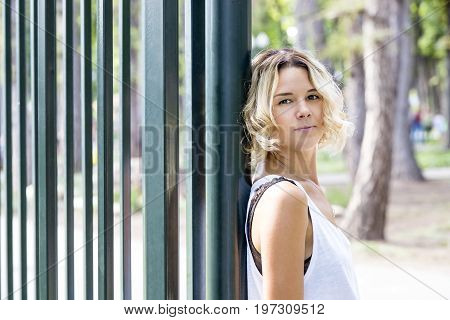 Portrait of a girl in a summer park outdoors