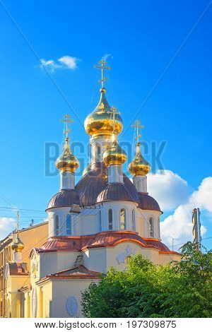 small Russian Orthodox church with golden domes