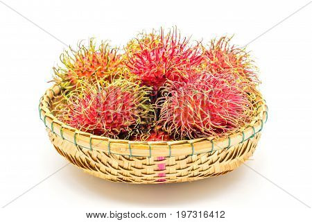 fresh tropical rambutan fruits over basket on a white background fruit in Thailand