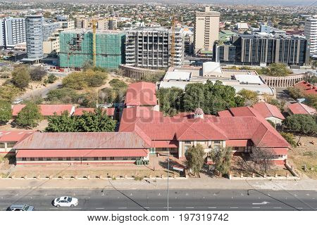 WINDHOEK NAMIBIA - JUNE 17 2017: An aerial view of the National Museum in Windhoek previously the Emma Hoogenhout Primary School. Part of the central business district is in the back