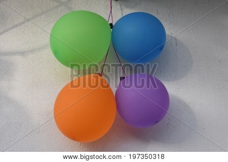 Some party balloons are waiting for a birthday