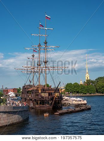 Saint Petersburg, Russia - June 17, 2017: the floating restaurant -the flying Dutchman - in the form of a sailing ship. Located on the Mytninskaya embankment of the Neva. The restaurant on the background of the fortress.