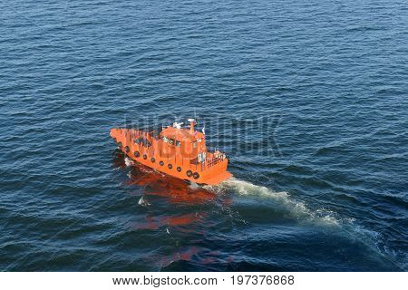 Helsinki, Finland-July 10, 2017: Pilot boat bringing pilot to the American Holland cruise ship Zuiderdam 