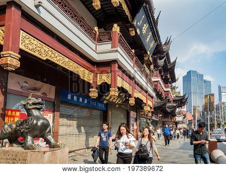 Shanghai, China - Nov 6, 2016: Fangbang Middle Road - Buildings with faithfully restored traditional Chinese architectural designs. Old Shanghai view captured from the street.