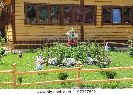 Schodnica Ukraine - July 08 2014: Folk style decorative figures before rural house. Carpathians Ukraine