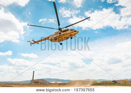 civil golden russian MI-8 helicopter landing in Russia