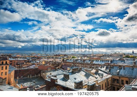 Saint Petersburg panorama, view from roof in the center of old city or downtown, dramatic sky, roofs of houses, horizon. HDR image