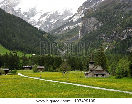 Church and alpine meadows at Kandersteg, Switzerland