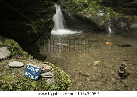 Beautiful Flowing Waterfall With Magical Fairytale Feel In Lush Green Forest Location