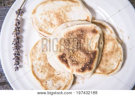 Pancakes with apples decorated with lavender and sugar