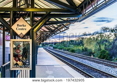 Burke, Usa - April 16, 2017: Burke Centre Train Station Platform With Sign And Tracks