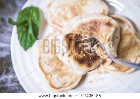 Pancakes With Apples Decorated With Mint And Sugar
