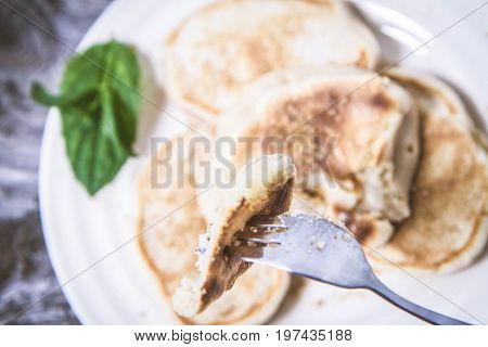 Pancakes With Apples Decorated With Mint And Sugar