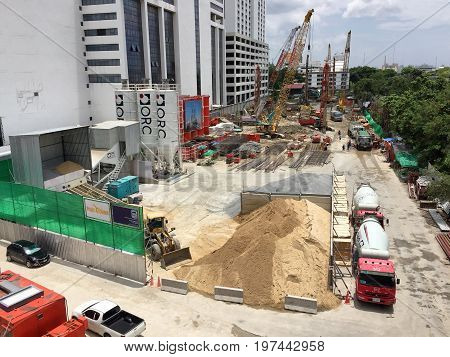 BANGKOK THAILAND 28 JULY 2017: Workers fabricating column timber formwork and reinforcement bar at the construction site near the Phayathai BTS station
