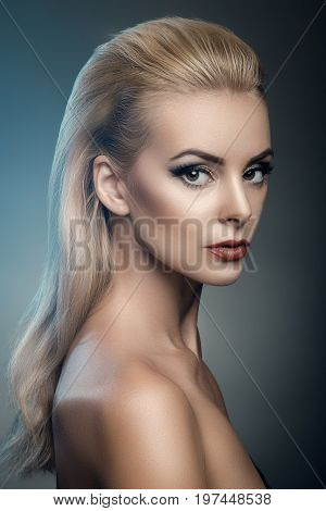 portrait of model in studio beautiful blonde with makeup