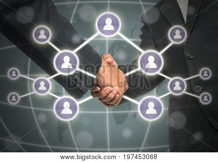 Business handshake with Social media symbol over the world map background Elements of this image furnished by NASA Business social netwok concept