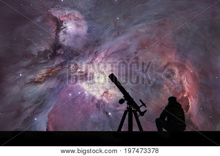 Man With Telescope Looking At The Stars. The Orion Nebula Messier 42 Diffuse Nebula  In Constellatio