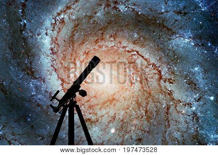 Space Background With Silhouette Of Telescope. Pinwheel Galaxy Messier 101, M101 In The Constellatio