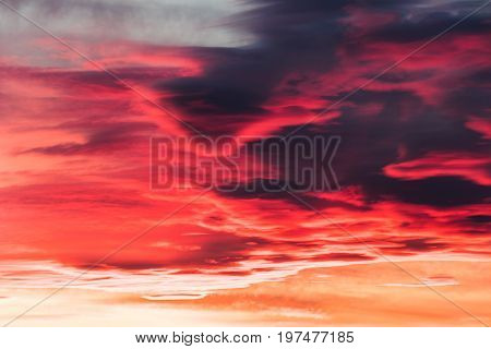 colorful fiery sky abstract at sunset with altocumulus clouds