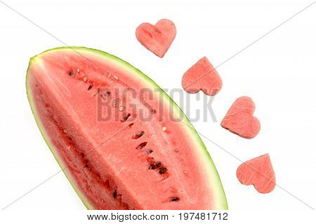 Fresh watermelon slice with carved hearts on white background isolated
