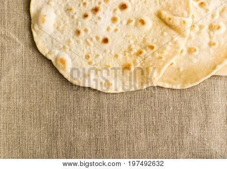 Flat Bread On A Burlap Background