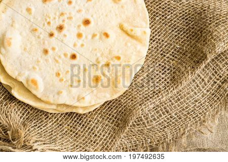 Flat Bread On A Burlap Background
