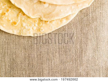 Flat Bread On A Burlap Background