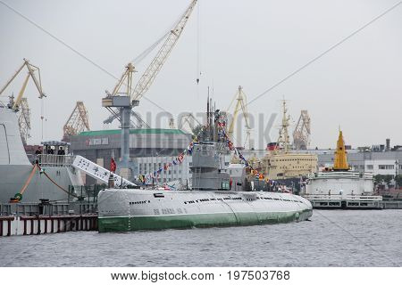 Saint-Petersburg, Russia - Jul 29 2017: Museum Of Submarine S-189 project 613 on the background of port cranes. Summer. Rain. The Lieutenant Schmidt embankment of Vasilevsky Island. 1954 built.