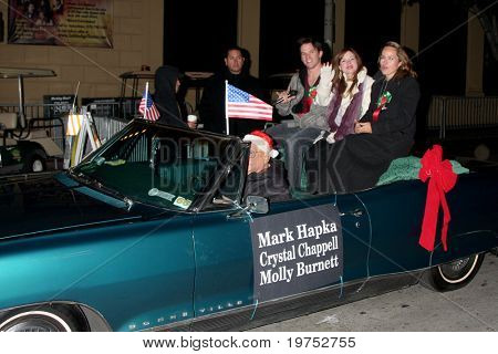 LOS ANGELES - NOV 28:  Mark Hapka, Moly Burnett, Chrystal Chappell arrive at the 2010 Hollywood Christmas Parade at Hollywood Boulevard on November 28, 2010 in Los Angeles, CA