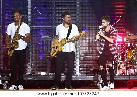 TWIN LAKES, WI-JUL 22: (L-R) Frank Houston, Travis  Vance and Thomas Rhett perform at Country Thunder Music Festival on July 22, 2017 in Twin Lakes, Wisconsin.
