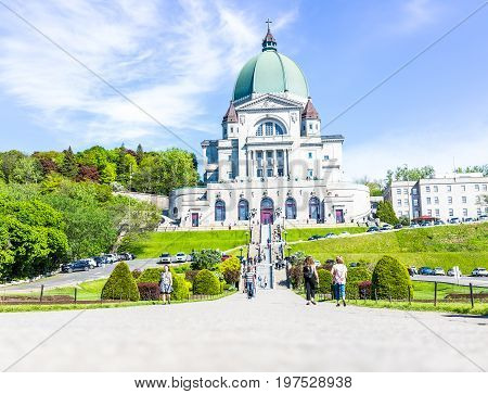 Montreal Canada - May 28 2017: St Joseph's Oratory on Mont Royal with people walking climbing steps in Quebec region city