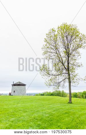 Quebec City Canada - May 30 2017: Martello tower watchtower in plaines d'Abraham with green grass field