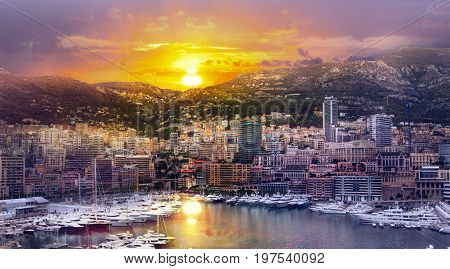 Monaco at sunset. Main marina of Monte Carlo with luxury yachts and sail boats at sunset