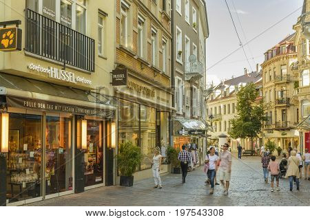 Historic center with Shopping street and Pedestrian zone with many restaurants and terraces full with tourists on July 29 2017 in Baden Baden Baden-Württemberg Germany.