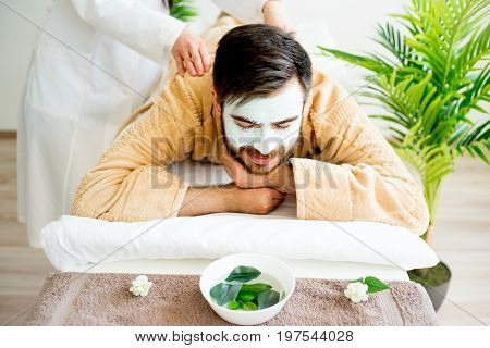 Man enjoying a massage session at spa