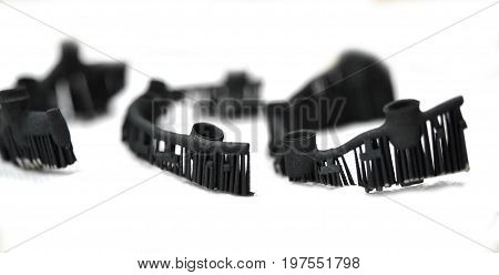 Object denture body printed on a laser sintering machine. Isolated on white background. Close-up.