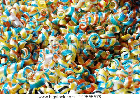 Multi-coloured swirly sweets / candy background / texture