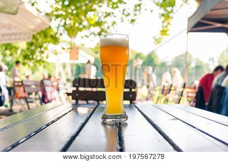 German Beer 0,5 Liter On Wooden Table Biergarten Traditional Culture Beautiful Day