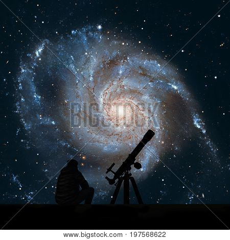 Man With Telescope Looking At The Stars. Pinwheel Galaxy Messier