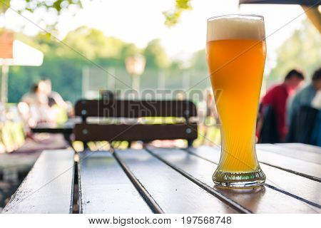 German Beer 0,5 Liter On Wooden Table Biergarten Traditional Culture Beautiful Day