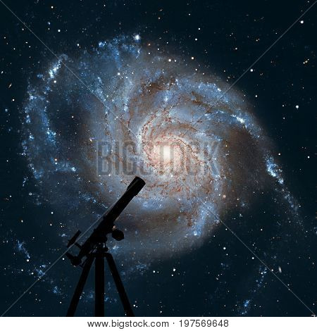 Space Background With Silhouette Of Telescope. Pinwheel Galaxy M