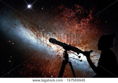 Girl Looking At The Stars With Telescope. Messier 82, Cigar Galaxy Or M82 In The Constellation Ursa