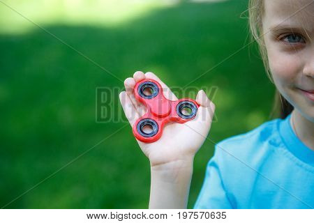 Girl Holding Popular Fidget Spinner Toy