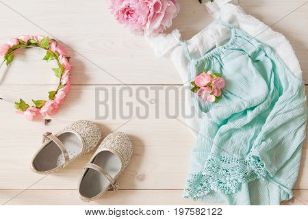 Girl's Dress, Floral Tiara And Shiny Shoes On A Wooden Background.