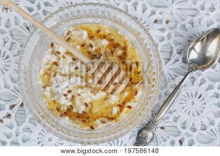 Healthy breakfast. Cottage cheese plus oat flakes linseed and honey.